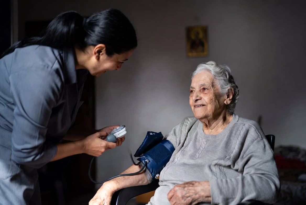 Healthcare volunteer visiting elderly Lebanese woman